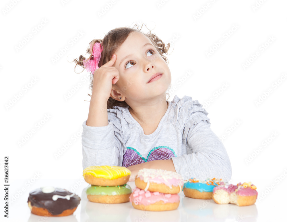 Little beautiful girl with donuts over white Little beautiful girl with donuts over white