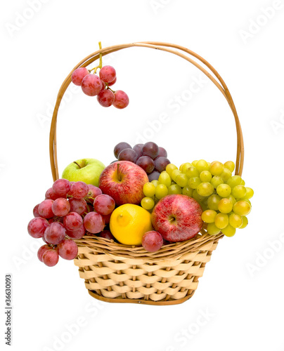Fresh fruit in a wicker basket on a white background
