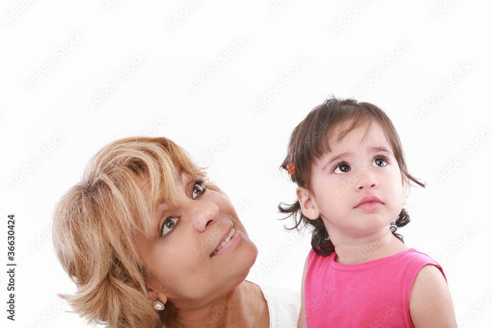 Cute girl and attractive young woman both looking up Cute girl and attractive young woman both looking up