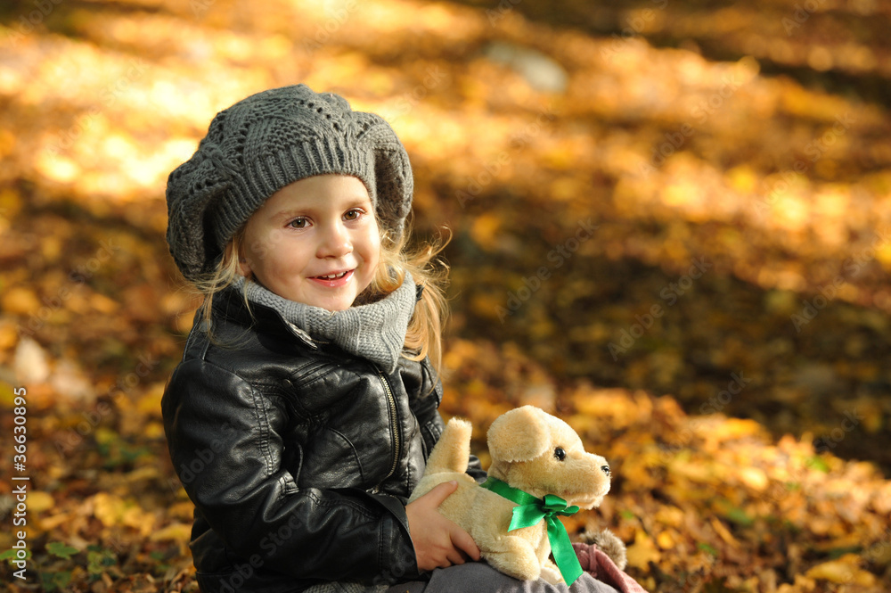 Little girl in autumn leaves Little girl in autumn leaves