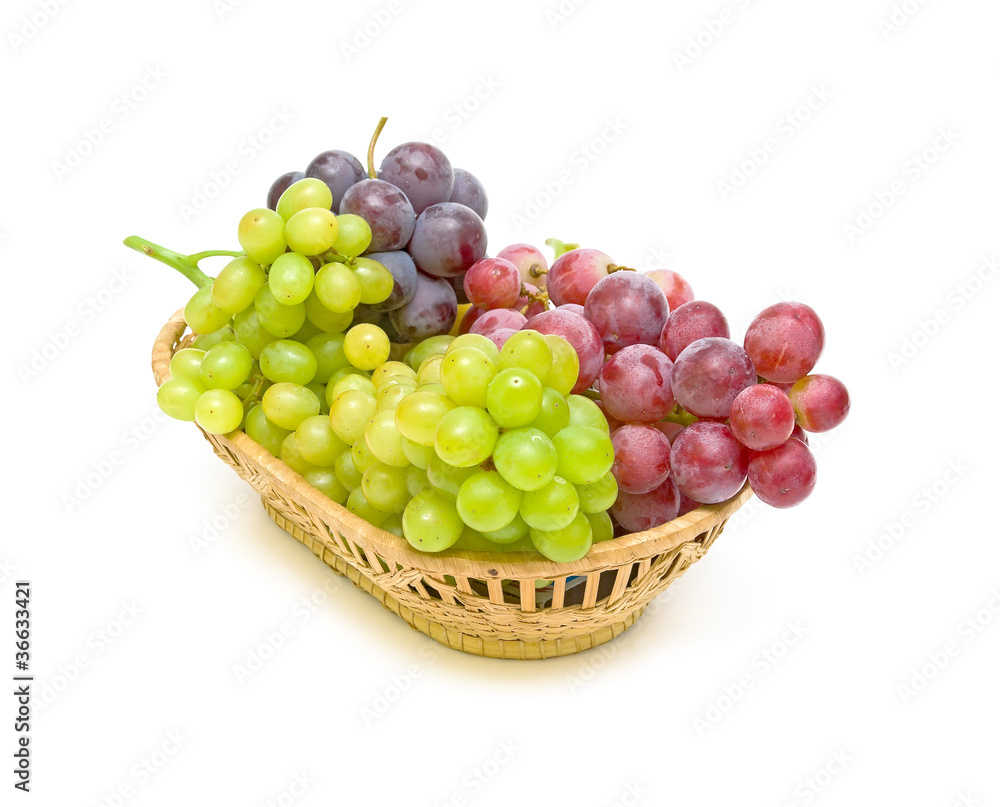 grapes in a basket on a white background grapes in a basket on a white background