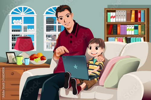 Father and son using computer