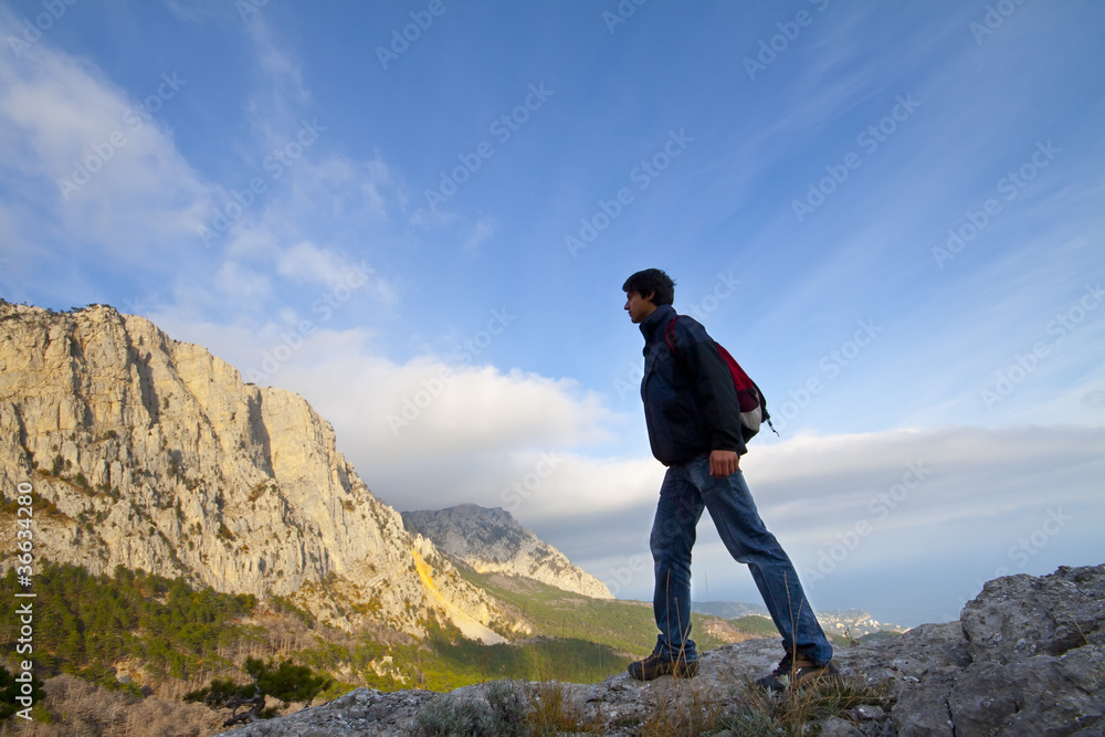 man on top of the mountain