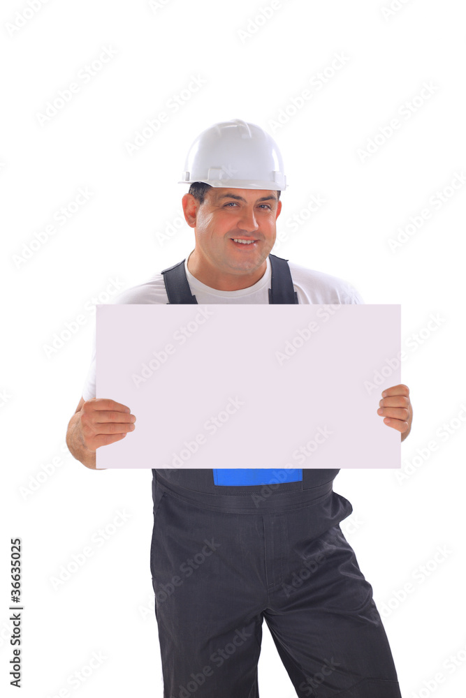 Young handsome contractor holding a banner Young handsome contractor holding a banner