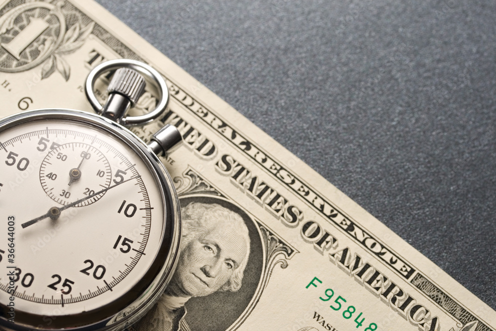Stopwatch and dollars Stopwatch and dollars
