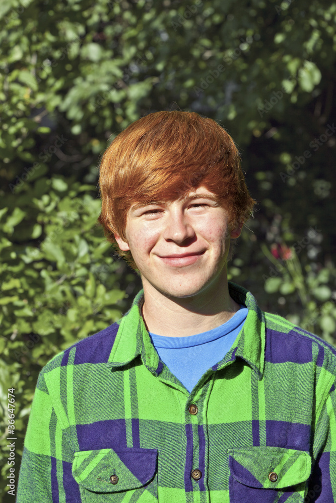 portrait of attractive happy smiling boy in the garden portrait of attractive happy smiling boy in the garden