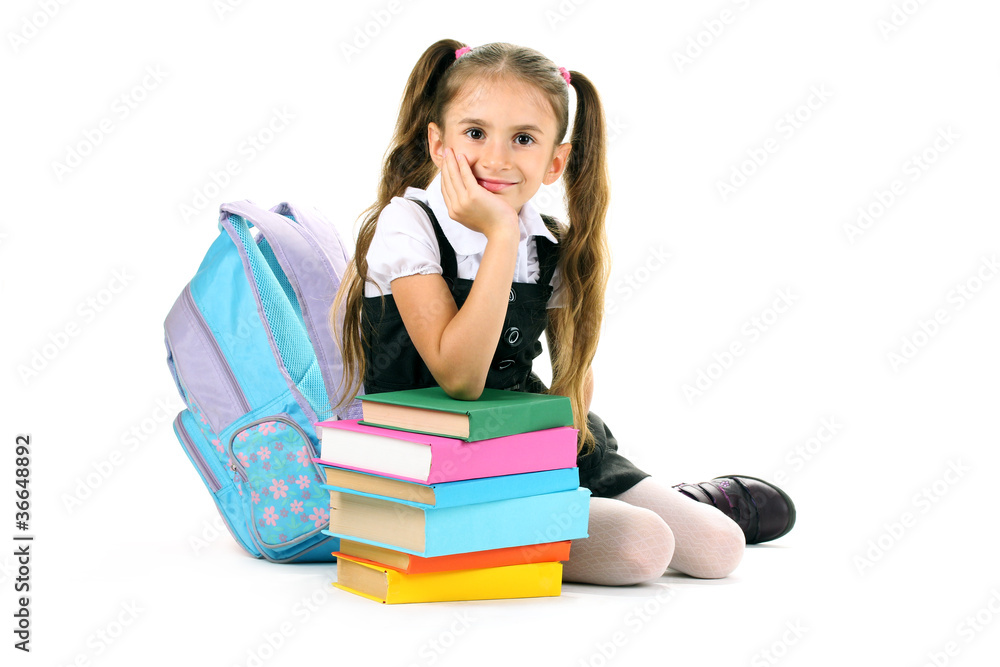 beautiful little girl, books and a backpack isolated on white beautiful little girl, books and a backpack isolated on white