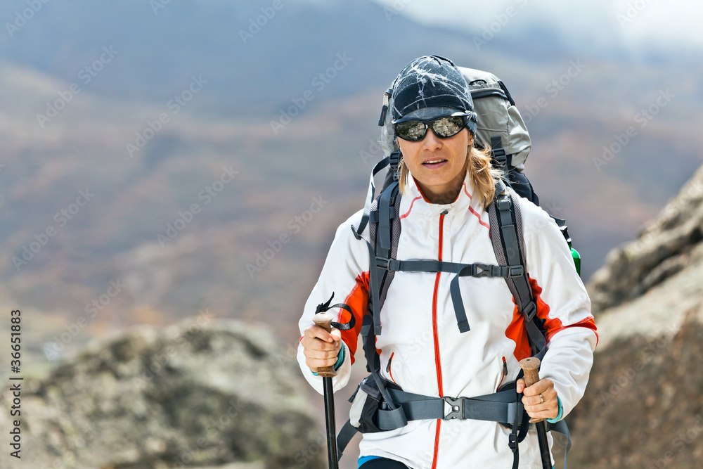 Woman trekking in mountains