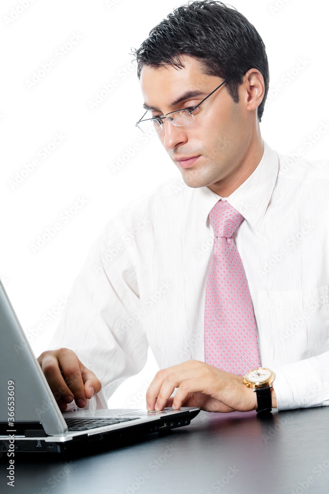 Businessman in glasses working with laptop, isolated Businessman in glasses working with laptop, isolated