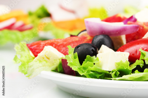 Tasty greek salad on plate closeup