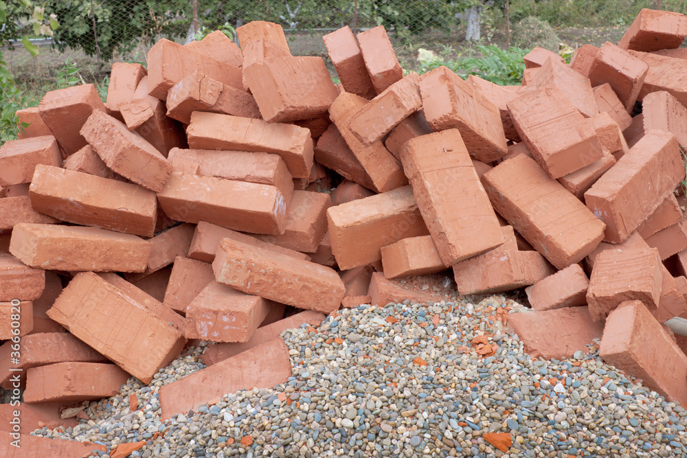 Red clay bricks lying on the gravel