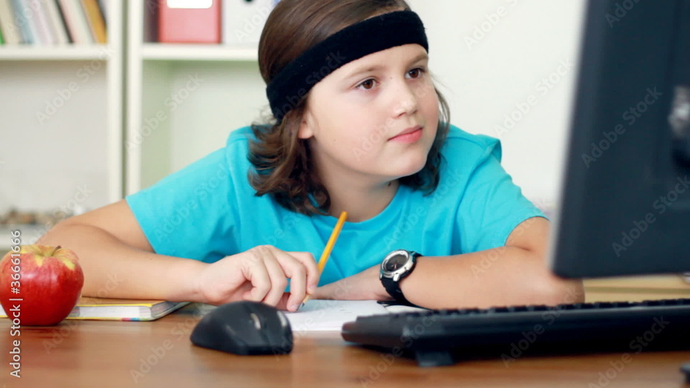 Young teenager doing homework in home Young teenager doing homework in home