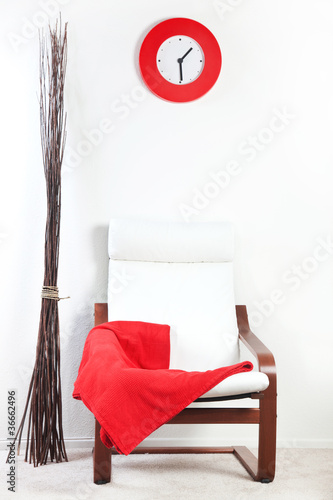 Red plaid draped over a chair