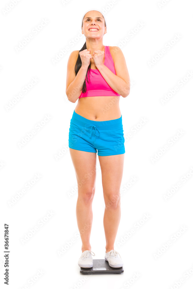 Satisfied with her weight girl standing on floor scale Satisfied with her weight girl standing on floor scale