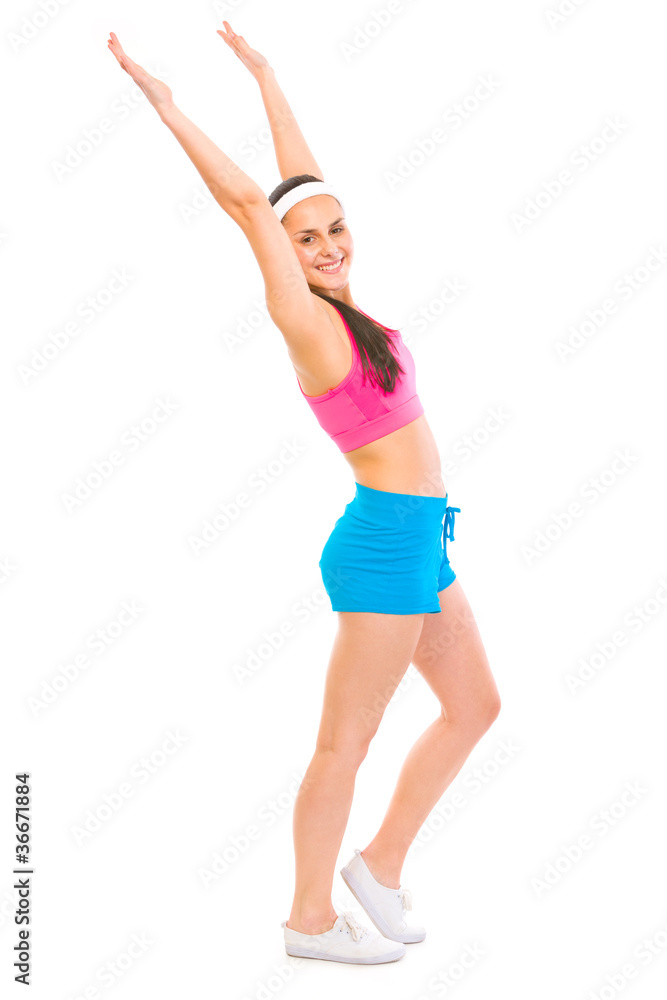 Smiling fitness woman in sportswear making exercise Smiling fitness woman in sportswear making exercise