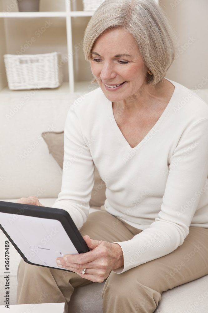 Attractive Senior Woman Using a Tablet Computer Attractive Senior Woman Using a Tablet Computer