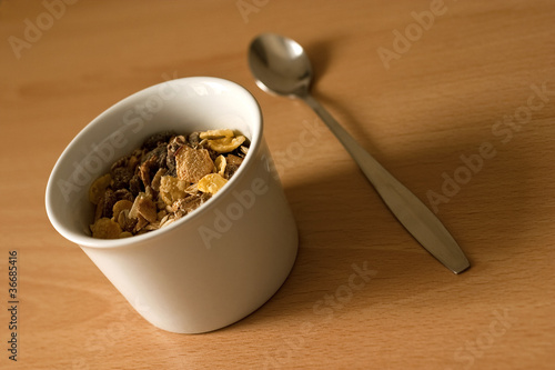 Healthy cereals in a bowl with a spoon