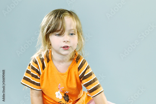 Little girl playing in studio photo