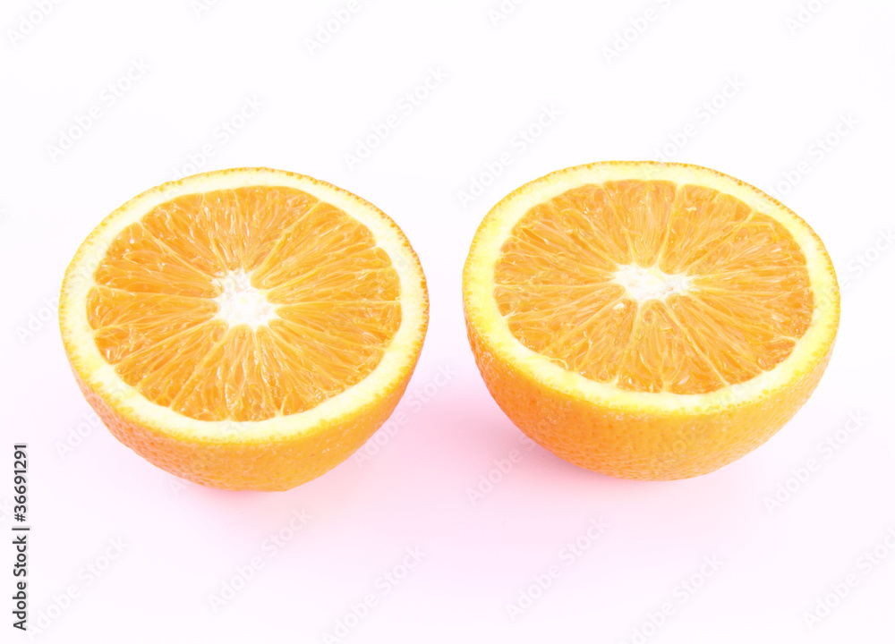 Orange cut in half on a white background Orange cut in half on a white background