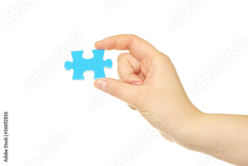 hand holding a puzzle