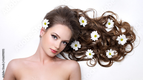 Beautiful woman with long hair in flower