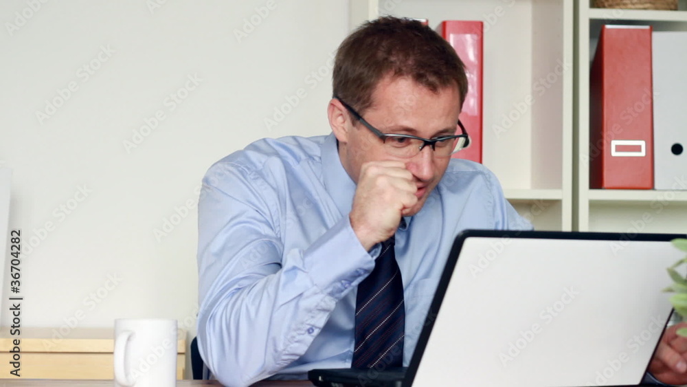 Young businessman gets bad news on his laptop, steadicam shot Young businessman gets bad news on his laptop, steadicam shot