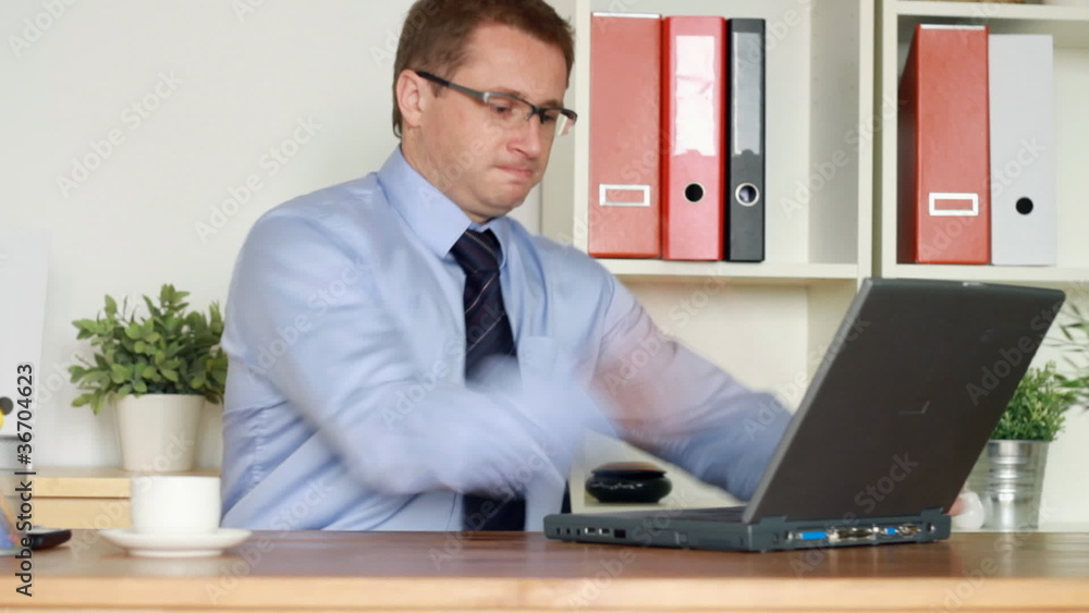 Angry businessman hitting in the office, steadicam shot Angry businessman hitting in the office, steadicam shot