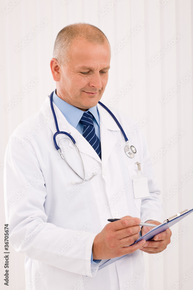 Mature doctor male portrait write document Mature doctor male portrait write document