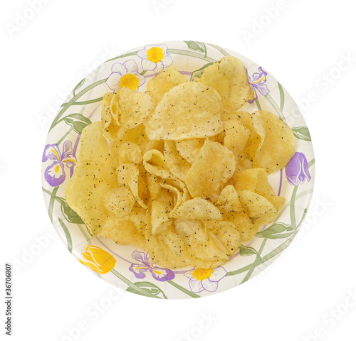 Salt and pepper potato chips on plate