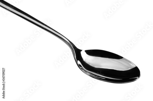 Silver spoon on white background