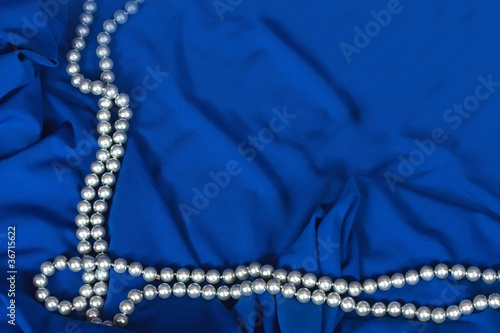 necklace on a blue fabric