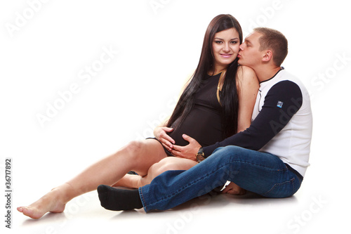 Portrait of happy pregnant woman with husband