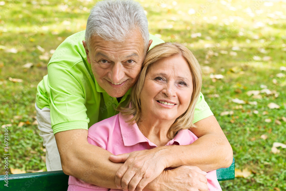 happy elderly man embracing mature woman happy elderly man embracing mature woman