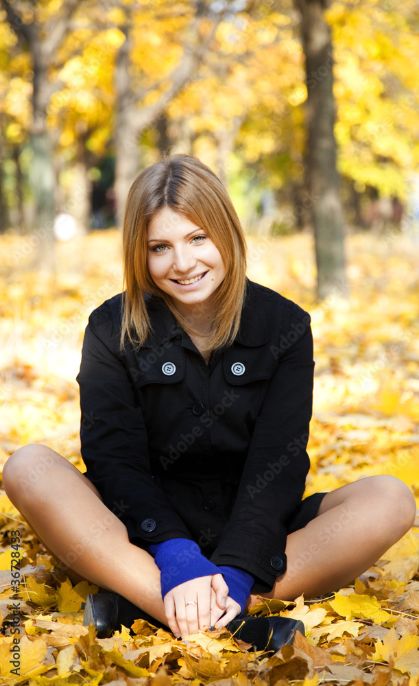 Smiling happy girl in autumn park Smiling happy girl in autumn park