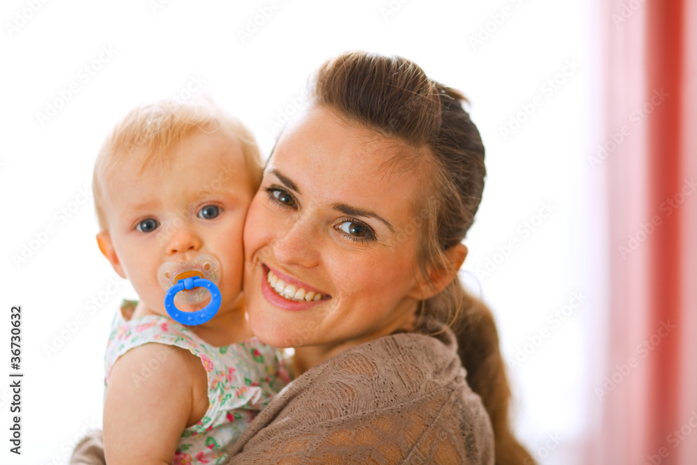 Portrait of beautiful young mother with her baby Portrait of beautiful young mother with her baby
