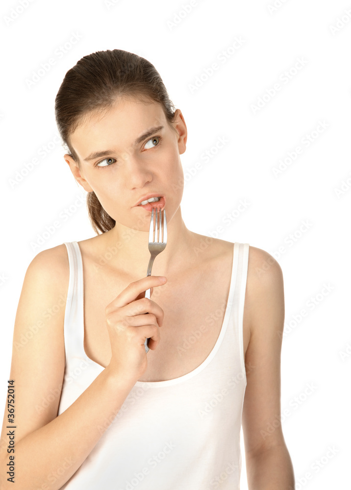 Pretty thoughtful woman with fork looking up Pretty thoughtful woman with fork looking up