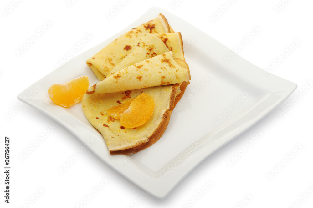 Crepe on a plate with mandarin Crepe on a plate with mandarin