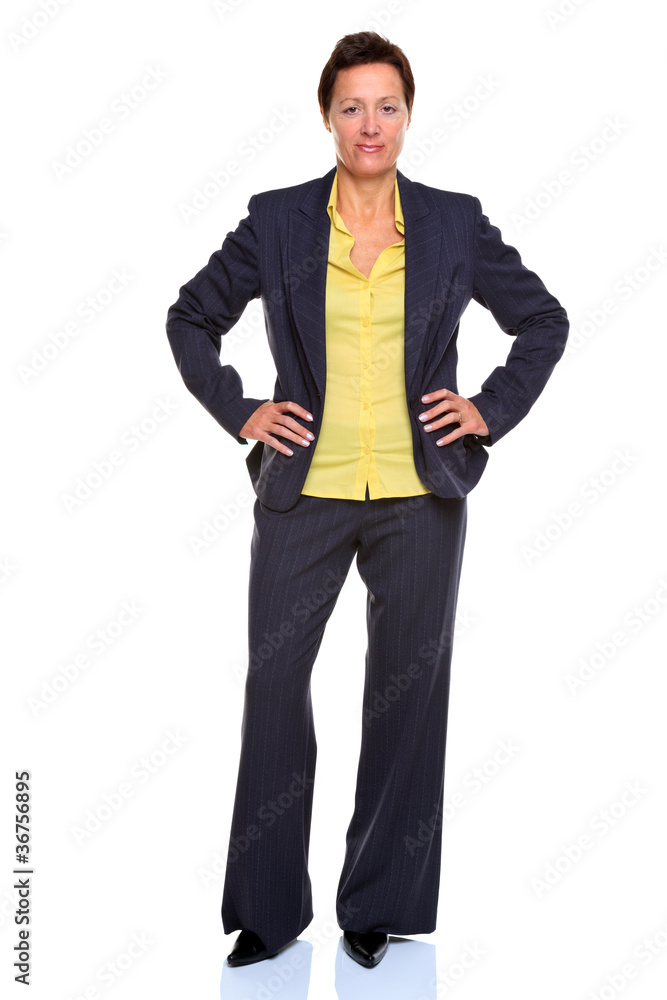 Mature businesswoman hands on hips isolated on white Mature businesswoman hands on hips isolated on white