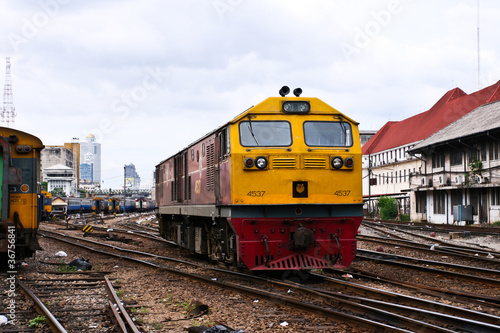 Yellow train engine and rail track