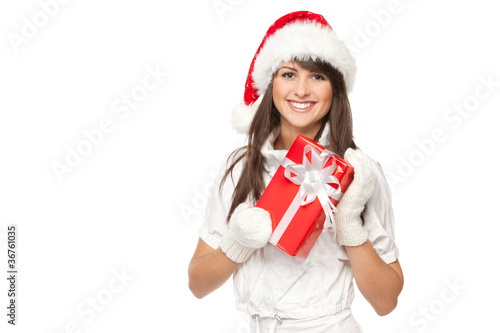 Young smiling girl in Santa hat holding red gift box photo