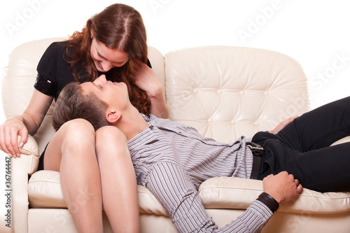 young man lies in the lap of woman