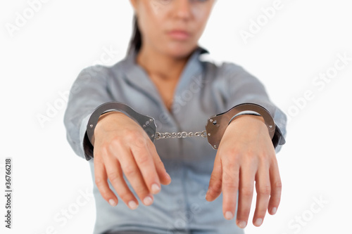 Guilty businesswoman with handcuffs
