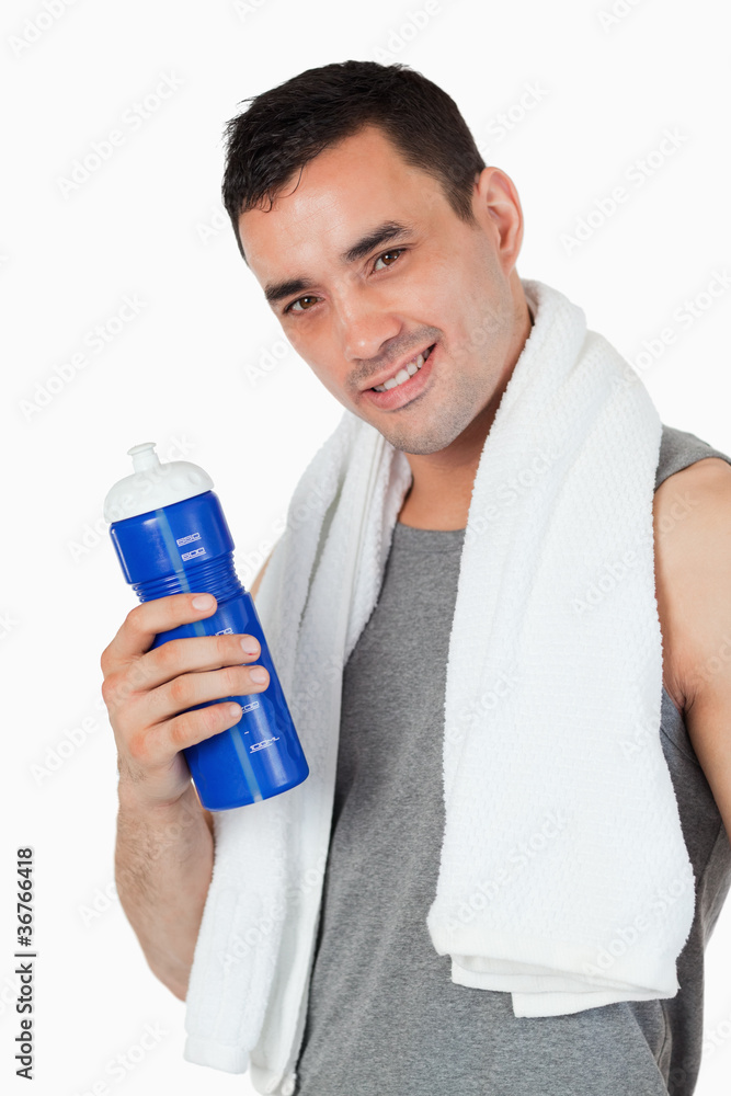 Young male with his bottle after training Young male with his bottle after training