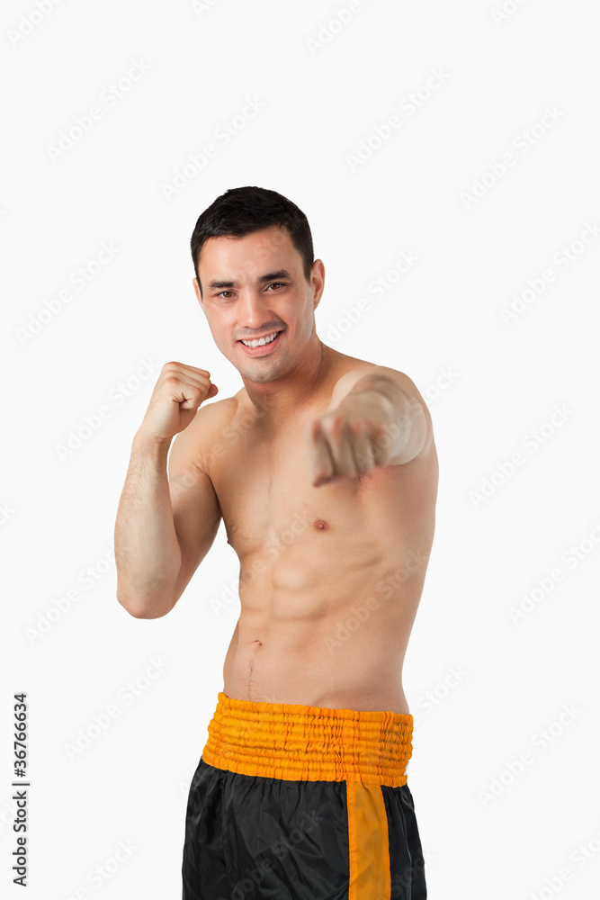 Fototapeta premium Smiling young martial art fighter
