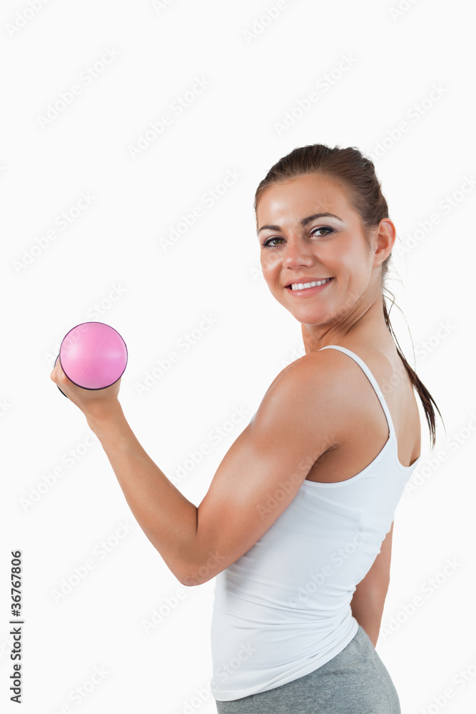 Portrait of a joyful woman working out with dumbbells Portrait of a joyful woman working out with dumbbells