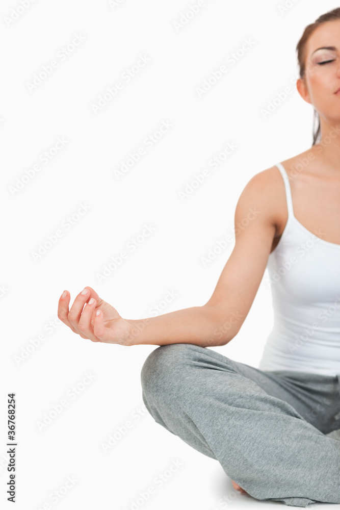 Portrait of a meditating woman in the Sukhasana position Portrait of a meditating woman in the Sukhasana position