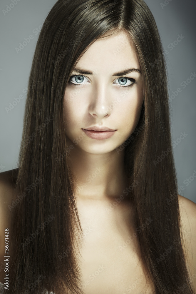 Fashion portrait of young beautiful woman. Close-up Fashion portrait of young beautiful woman. Close-up