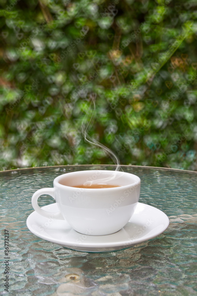 cup of tea on glass table cup of tea on glass table