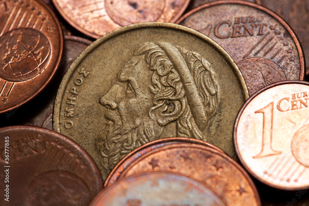 Old greek coin among euro coins, drachmas Old greek coin among euro coins, drachmas