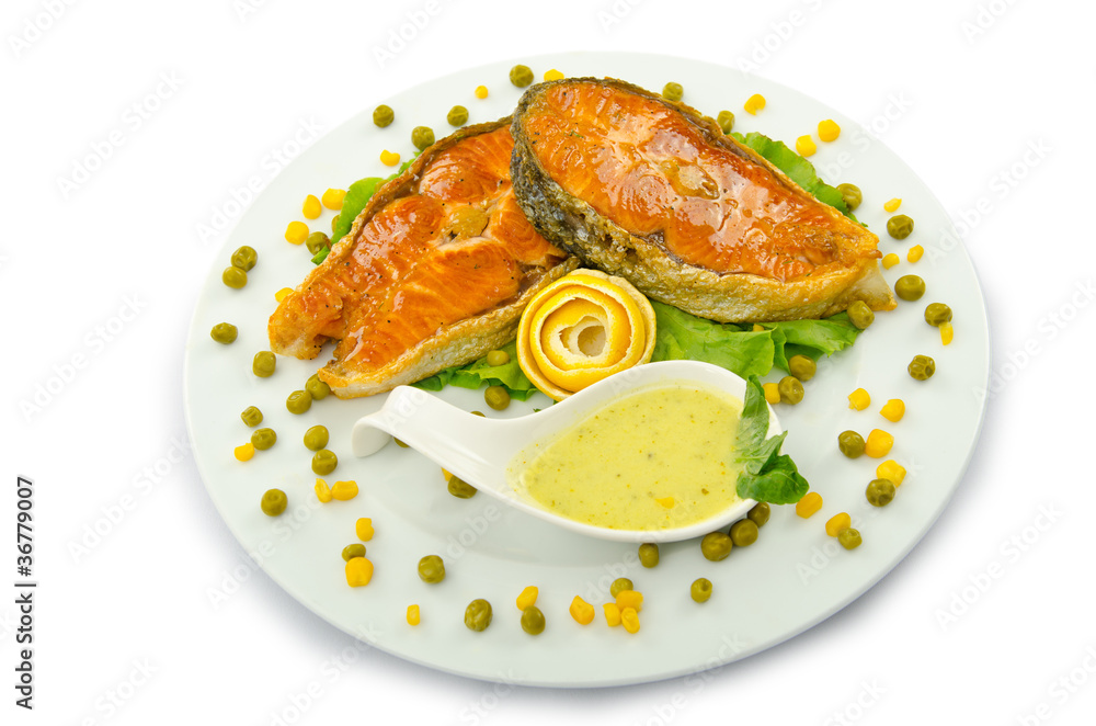 Salmon roasted and served in the plate Salmon roasted and served in the plate